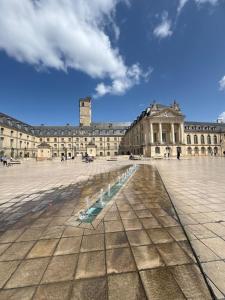 a large building with a fountain in front of it at Linda Studio - Historic Center in Dijon