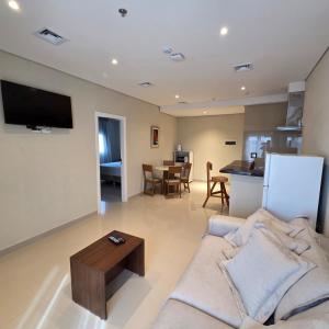 a living room with a couch and a table at Zielo Hotel in Asuncion