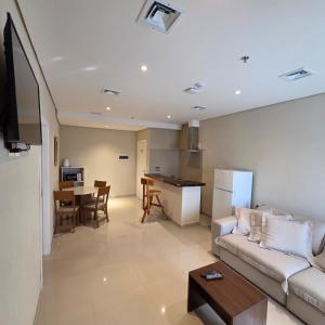a living room with a couch and a table at Zielo Hotel in Asuncion