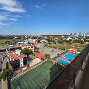 an aerial view of a park with a tennis court at Zielo Hotel in Asuncion