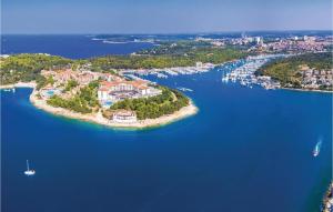 an island in the middle of a large body of water at Spacious, Newly Renovated, Pula Rooftop Apartment with Marina Views in Pula