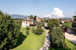 an aerial view of a yard with trees and a house at Villa Sawian in Appiano sulla Strada del Vino