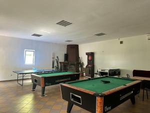 a room with two ping pong tables in it at U Karola in Karpicko