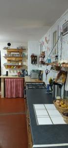 a kitchen with a counter top in a kitchen at Chambre d'hôte Vaccarès in Arles