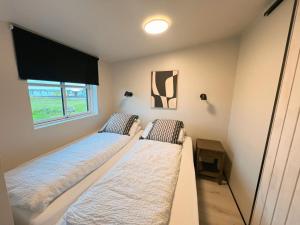 Letto o letti in una camera di Garður Apartments