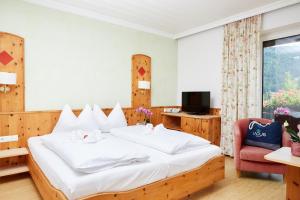 LACUS Hotel am See客房内的一张或多张床位