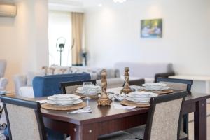 a dining room table with plates and dishes on it at ALANYA KONAKLİ APART in Alanya