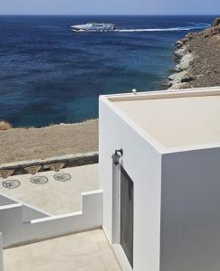 a white house with a view of the ocean at Aenya Kythnos Villas in Kithnos