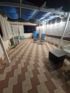 a waiting room with two chairs and a sink at Stone beach holiday home in Mascali +22 photos