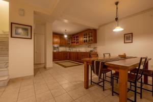 a large kitchen with a wooden table and chairs at House with Terrace in Sultanahmet in Istanbul