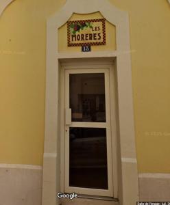 a door in a building with a sign above it at Les Morèses in Amélie-les-Bains-Palalda