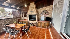 a kitchen with a table and chairs in a room at Relaxing Villa Las Torres in Adeje