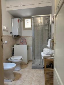 a bathroom with a toilet and a shower at VUCCIRIA 57 locazione turistica nel cuore pulsante della movida! in Palermo +56 photos