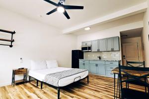 a bedroom with a bed and a ceiling fan at Unit 1 Waena Inn Newly Renovated Maui Private Suite in Wailuku