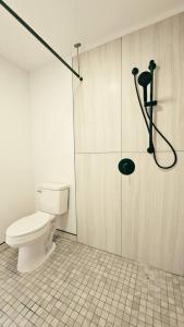 a bathroom with a toilet and a shower at Unit 1 Waena Inn Newly Renovated Maui Private Suite in Wailuku