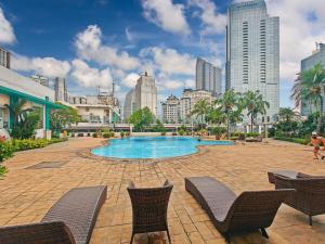 a swimming pool in the middle of a city at Large 2BR Ambassador 2 Apt Pool, Gym, WiFi in Jakarta