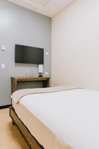 Ένα ή περισσότερα κρεβάτια σε δωμάτιο στο Dunas Hospedaje
