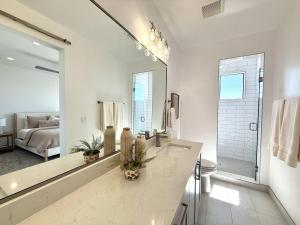a bathroom with a sink and a large mirror at Desert Family Townhome in Kanab Utah in Kanab +10 photos