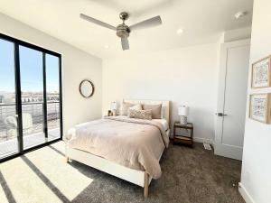 a bedroom with a bed and a ceiling fan at Desert Family Townhome in Kanab Utah in Kanab