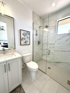 a bathroom with a toilet and a glass shower at Desert Family Townhome in Kanab Utah in Kanab