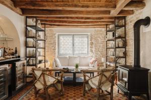 a living room with a table and a couch at La Cour de Beaune in Beaune