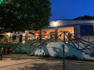 a house with a staircase in front of it at 03- Cachoeiras do Pinga, Tianguá in Tianguá