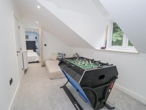 a room with a foosball table in the corner of a room at Frongoch Old Power House in Dolgellau