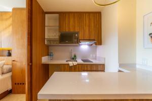 a kitchen with a white counter top in a room at Estudio con Terraza en Zantamar in Cruz de Huanacaxtle
