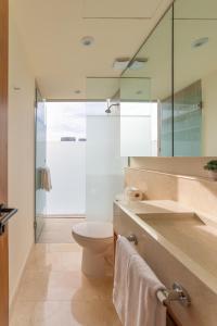 a bathroom with a toilet and a sink at Estudio con Terraza en Zantamar in Cruz de Huanacaxtle