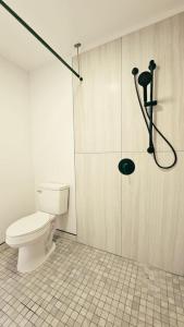 a bathroom with a toilet and a shower at Unit 4 Waena Inn Newly Renovated Maui Private Suite in Wailuku