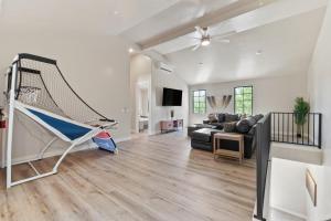 a living room with a couch and a net at Its about time, for adventure in Hurricane