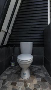 a white toilet sitting in front of a building at Resort Gili Trawangan - Private Pool Bungalow in Gili Trawangan +4 photos