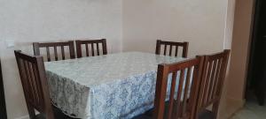 a table with a blue and white table cloth on it at Dyar alboughaz in Hajreien +2 photos