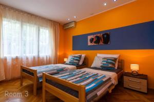 Postel nebo postele na pokoji v ubytování Apartments Lara - Split Croatia