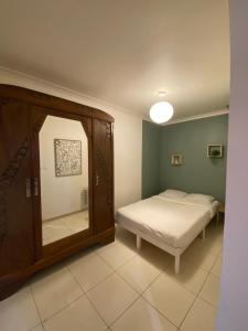 Ένα ή περισσότερα κρεβάτια σε δωμάτιο στο Appartement B