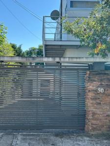 a garage door with the number on it at Los Fresnos 50 dpto 6 in Oro Verde