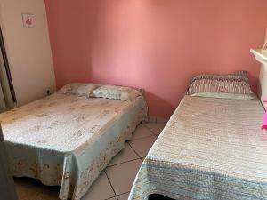 Ένα ή περισσότερα κρεβάτια σε δωμάτιο στο Casas Ataliba Conforto com Piscina em Búzios +11 φωτογραφίες