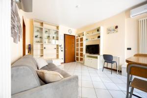 a living room with a couch and a table at Bologna - The Suite Apartment in Bologna