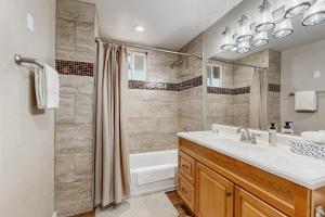 a bathroom with a tub and a sink and a shower at The Kachina Cabin in Mountainaire +20 photos