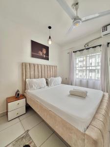 Katil atau katil-katil dalam bilik di Majestic Homes - Mombasa CBD +22 gambar
