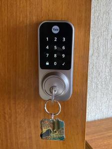 a key chain attached to a remote control at CasaOcho2 in Viña del Mar