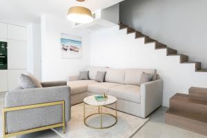 a living room with a couch and a table at Villa Maslina in Vela Luka +37 photos