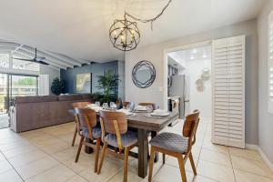 a dining room with a table and chairs at Sunny Palm Springs Oasis Getaway in Palm Springs