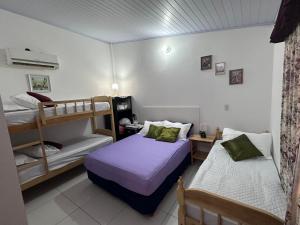 Voodi või voodid majutusasutuse Tu Hostal Alojamientos por día toas