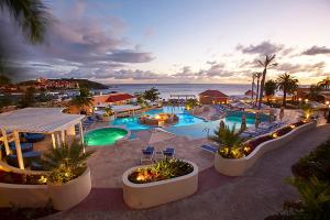 an aerial view of a resort with a swimming pool at Divi Little Bay Beach Resort in Philipsburg
