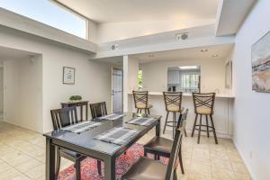 a dining room with a table and chairs at Palm Desert Condo with Community Perks WFH Friendly in Palm Desert