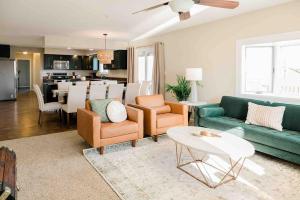 a living room with a couch and chairs and a table at The Estate on 68 AND Pet Friendly in Springfield