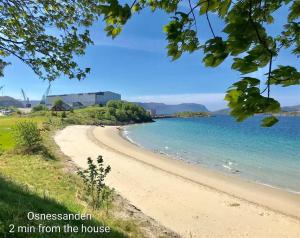 a beach with the words austerean min from the house at Bellahuset - Charming House in Ulsteinvik in Ulsteinvik +30 photos