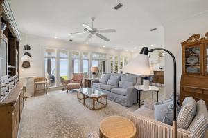 a living room with a couch and a table at Always On My Mind by 30A Escapes in Seacrest