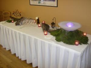 a table with a white table cloth with candles on it at The Originals City, Hôtel de France, Bessines-sur-Gartempe (Inter-Hotel) in Bessines-sur-Gartempe